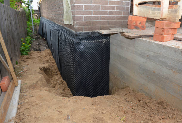 Happy homeowners after waterproofing job in Eau Claire